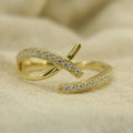 Micropavé diamond ring showcased in sustainable packaging, Elegant diamond crossover ring resting on velvet cushion, 