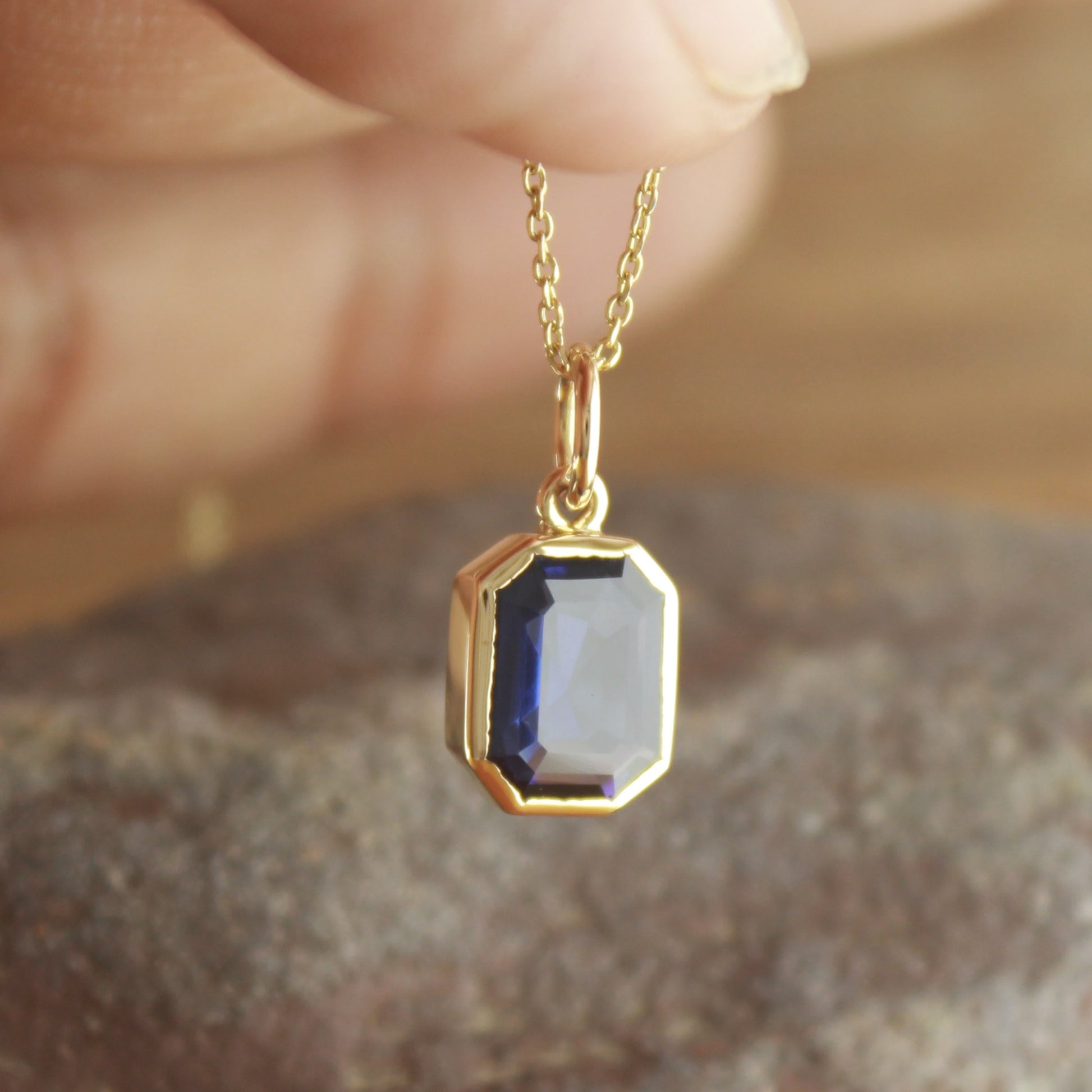 Simple Blue Sapphire Gold Charm – Elegant Daily Wear Necklace,
Minimal Gold Necklace with Lab Blue Sapphire – Classic Everyday Jewelry,
Emerald Cut Blue Sapphire Gold Necklace – Gift for Her,