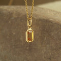 Simple & Elegant Bezel Set Orange Sapphire Gold Necklace for Gifting,
Petite Emerald Cut Orange Sapphire Charm in Gold – Wear Every Day,