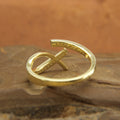 Top view of handcrafted crossover diamond ring, Artisan-made diamond ring displayed on hand, Recycled gold diamond ring with delicate crossover design