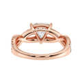 Natural light photo showing full sparkle of lab-grown trillion diamond ring, Artistic background shot with ring placed beside matching earrings and box, 