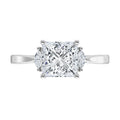 Diamond ring in white gold with a square princess cut center stone on a white background