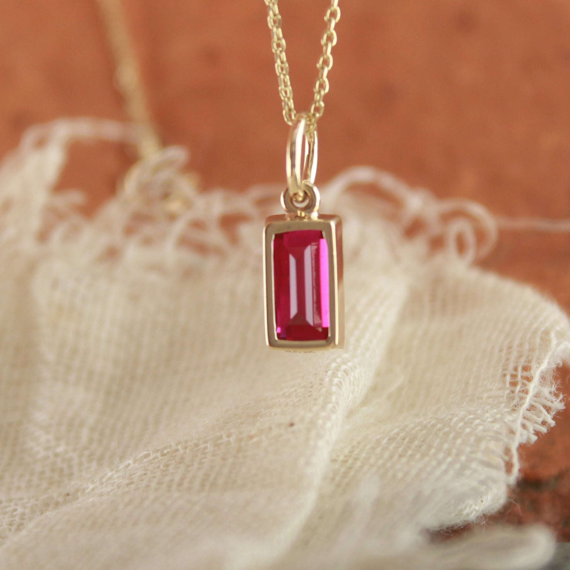 Delicate Ruby Pendant Necklace – Emerald Cut Lab Gemstone in Gold,
Handcrafted Ruby Pendant in Bezel Gold – Lightweight Jewelry Gift,