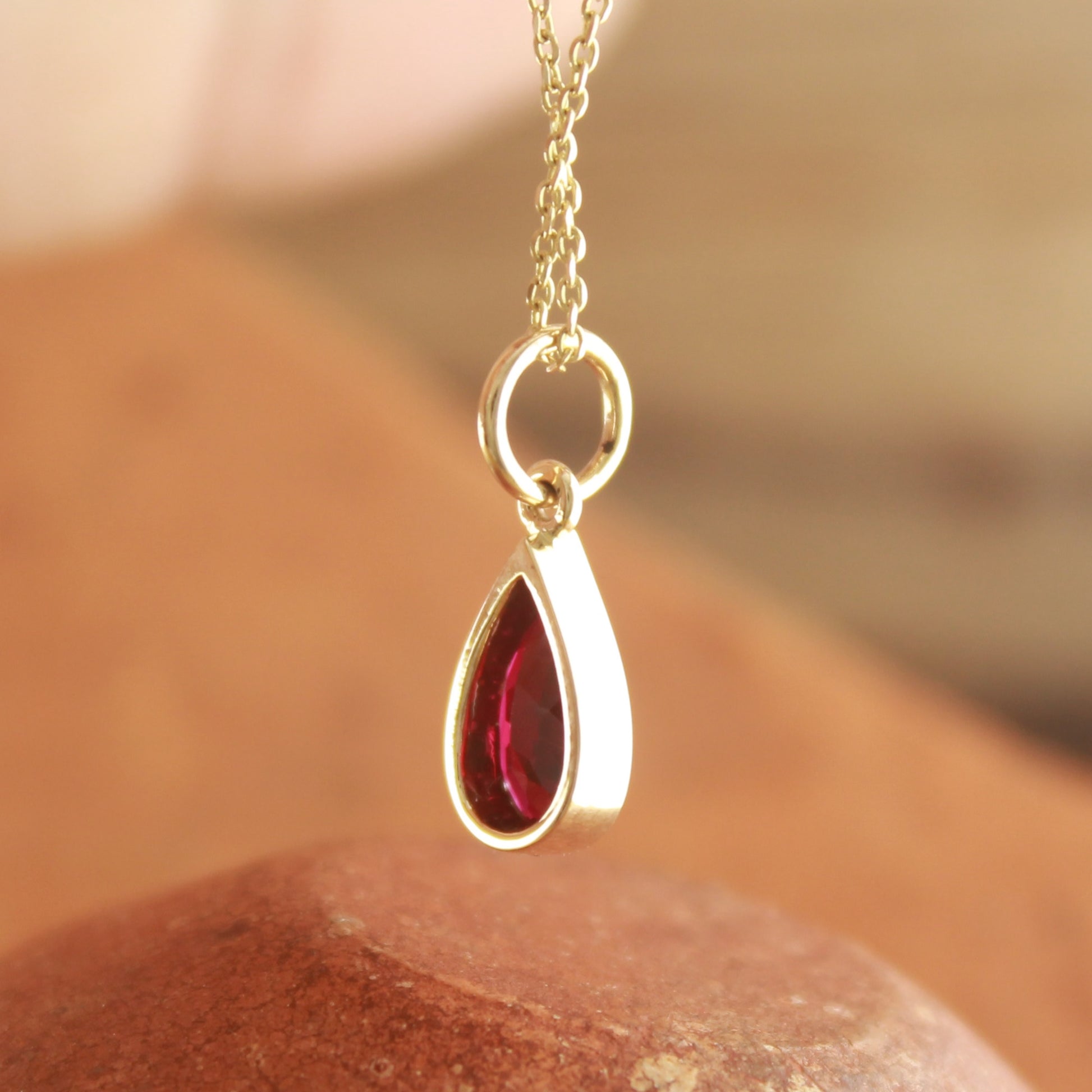 Bezel Set Lab Ruby Pendant in Pear Cut – Lightweight Daily Wear,
Minimalist Red Ruby Necklace – Gold Bezel Charm for Women,
Pear Cut Ruby Gemstone Necklace – Handmade Gold Jewelry,