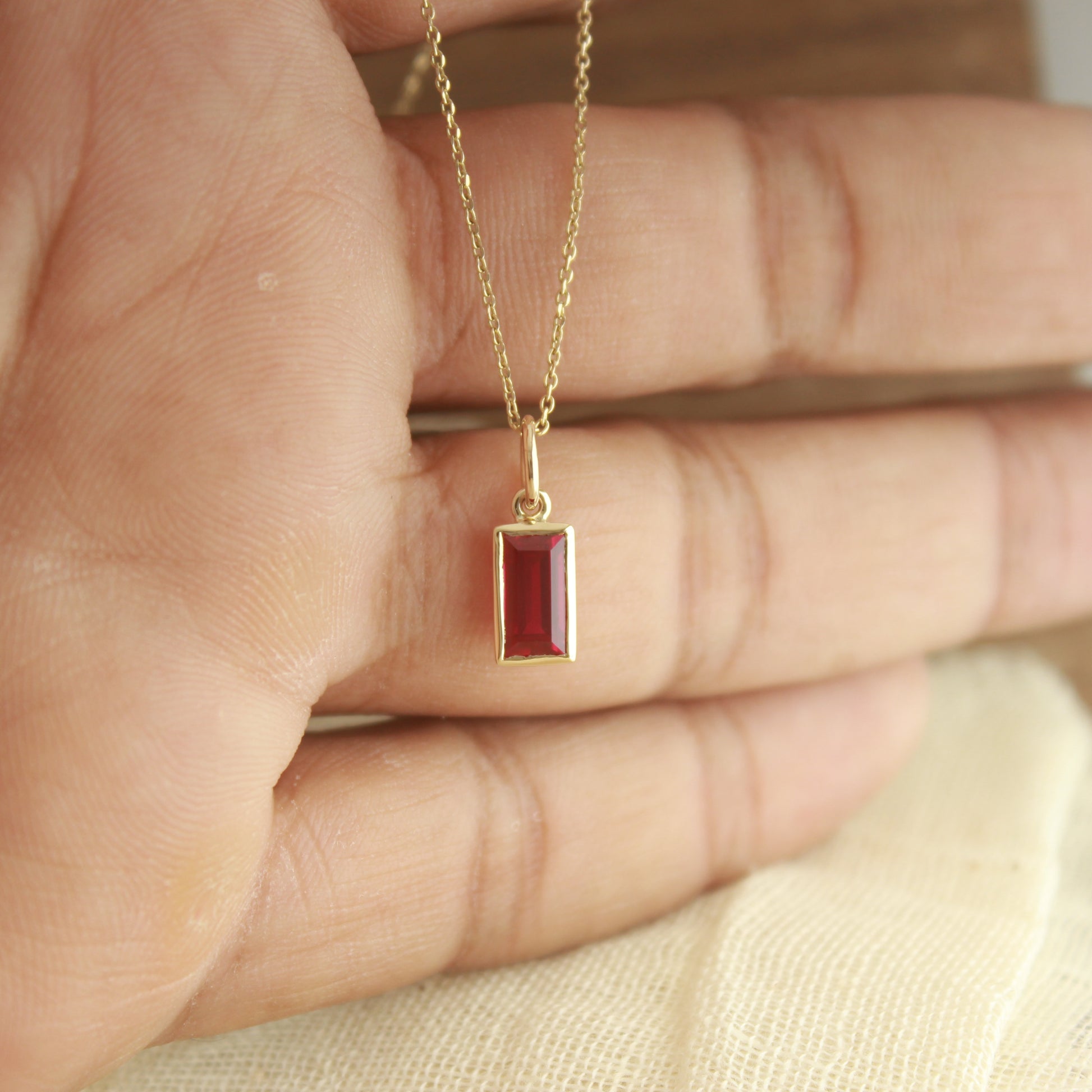 Elegant Emerald Ruby Necklace – Lab Created Pendant in Gold,
Sustainable Lab Ruby Pendant – Minimalist Emerald Cut Necklace,
Simple Gold Ruby Necklace – Emerald Shaped Gemstone Jewelry,
Ruby Bezel Pendant Necklace – Fine Jewelry for Daily Wear,